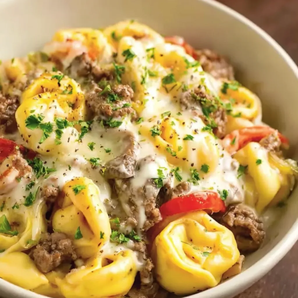 Serving suggestion: plated cheesesteak tortellini with parsley