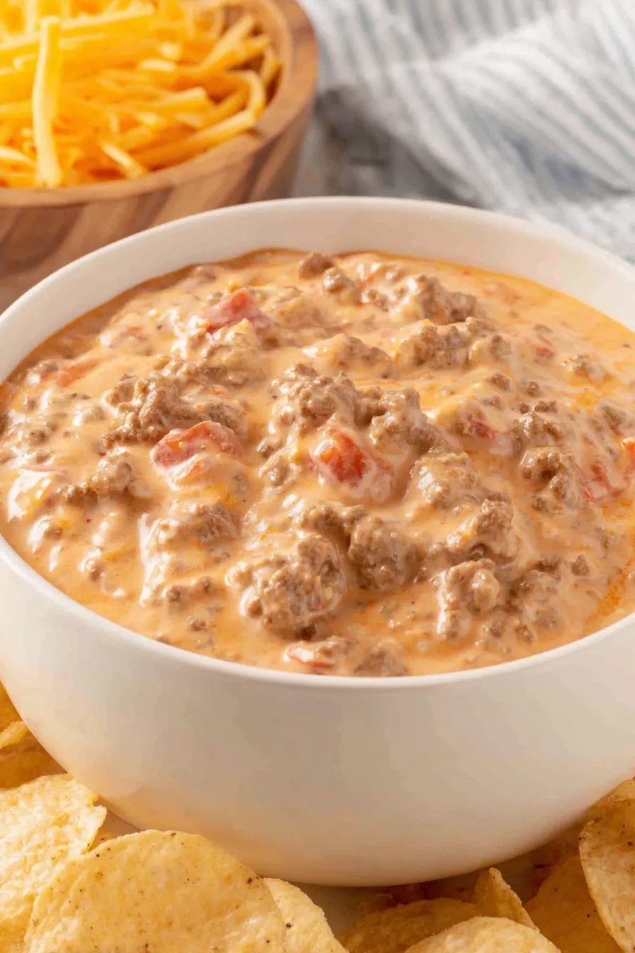 Serving Velveeta cheese dip with chips and garnishes
