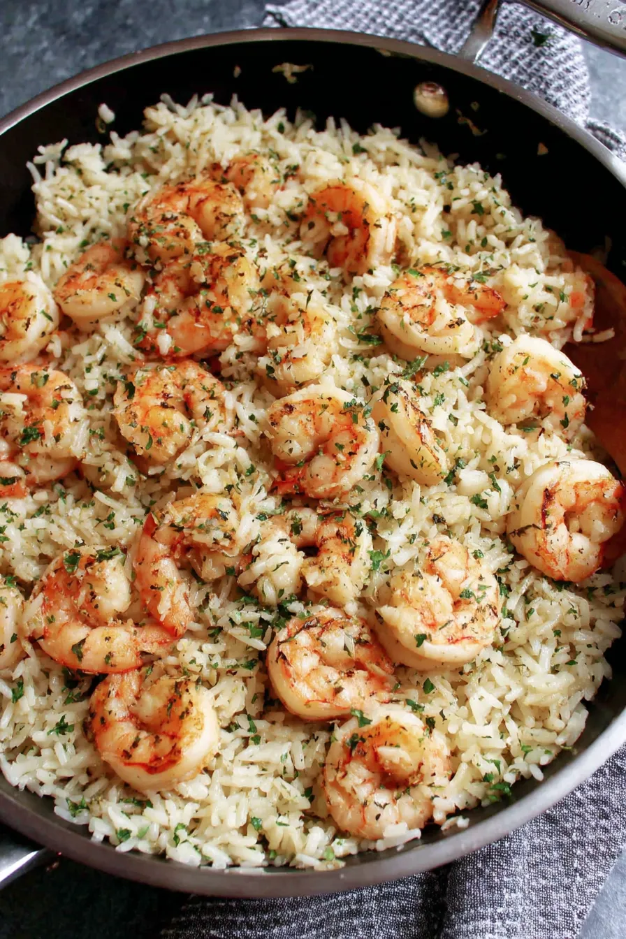 Garlic butter shrimp sizzling in a skillet