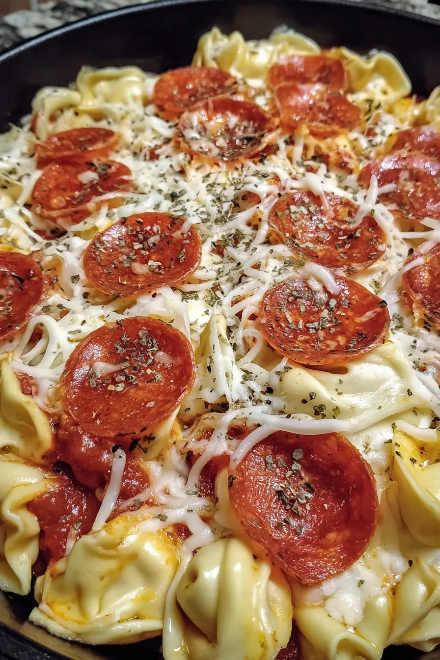 Close up of golden melted cheese and pepperoni on top of the casserole