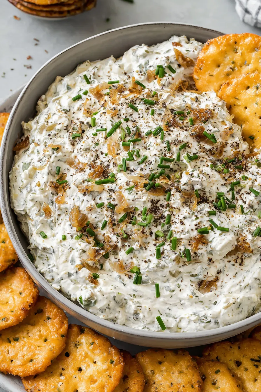 Creamy French onion dip served with chips