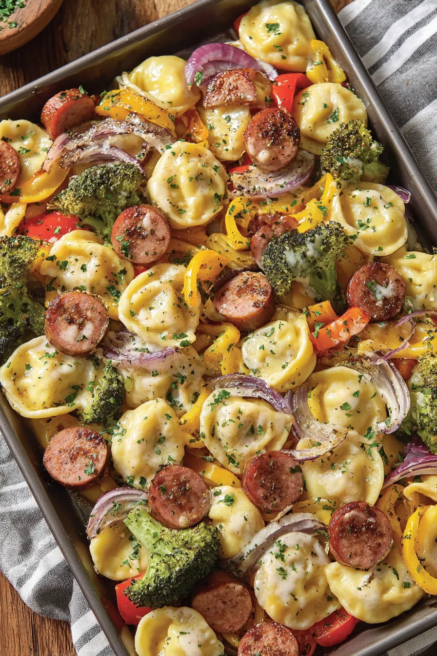 Sheet pan with pierogies and kielbasa roasting