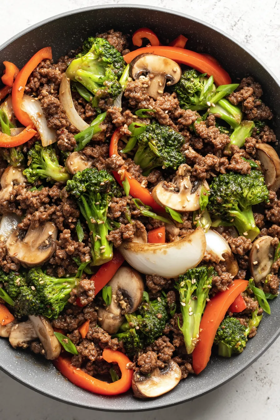 Plated ground beef stir fry with garnish