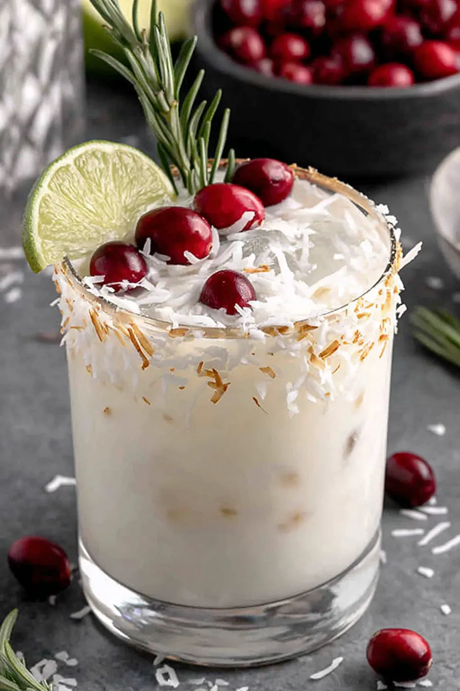 Close-up of coconut rim and cranberry garnish on a festive margarita