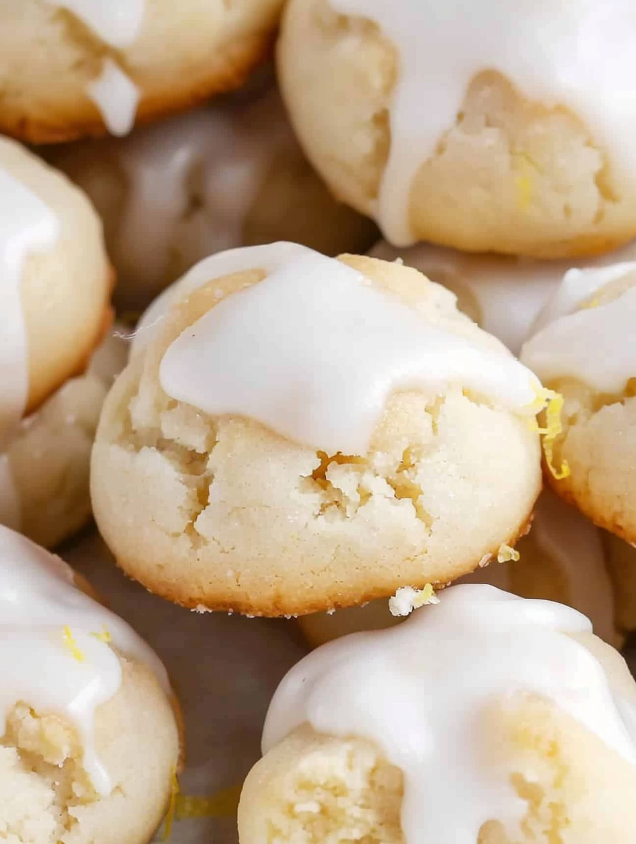 Glaze being drizzled over cookies