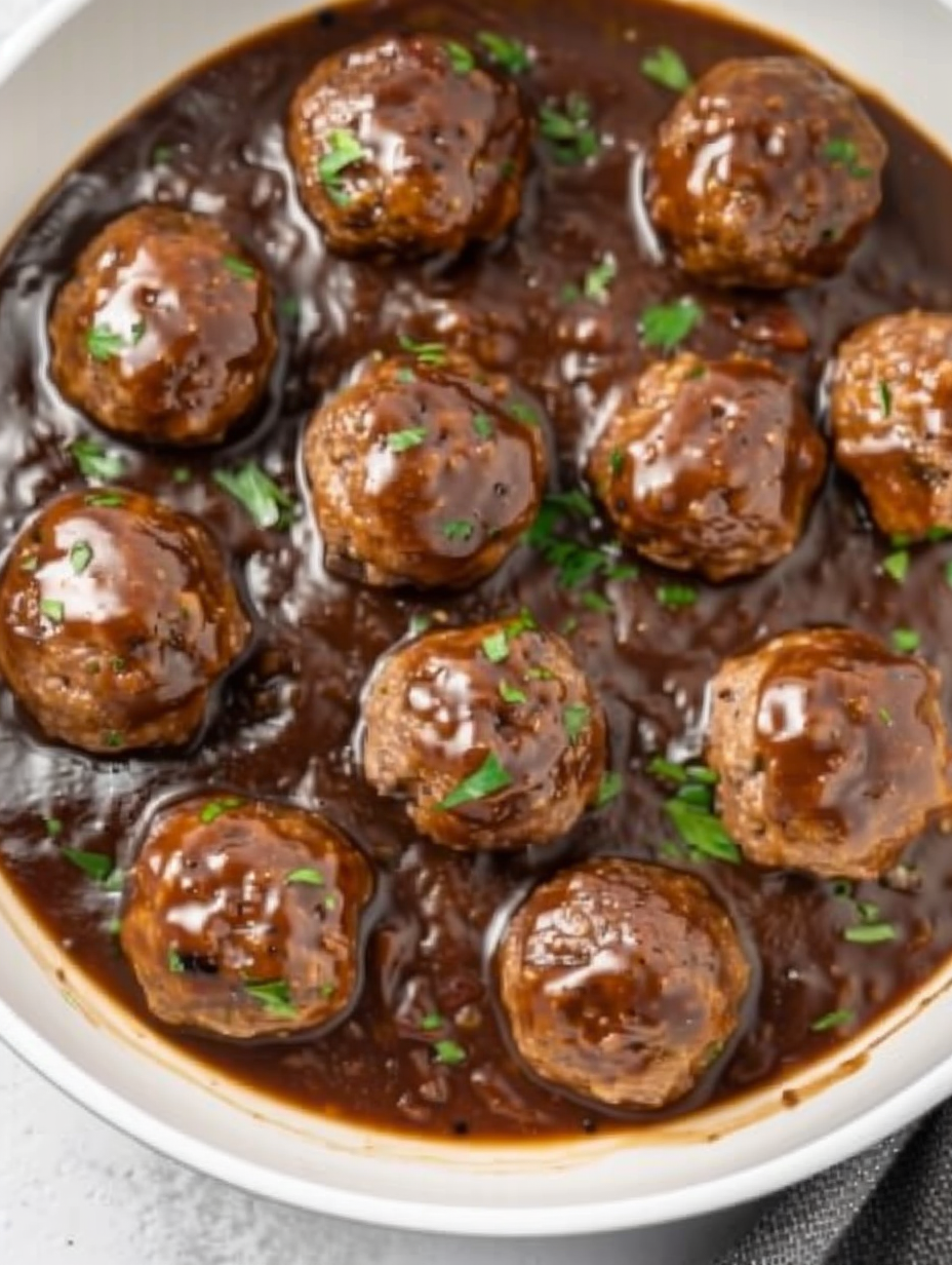 Smothered meatballs in rich onion gravy