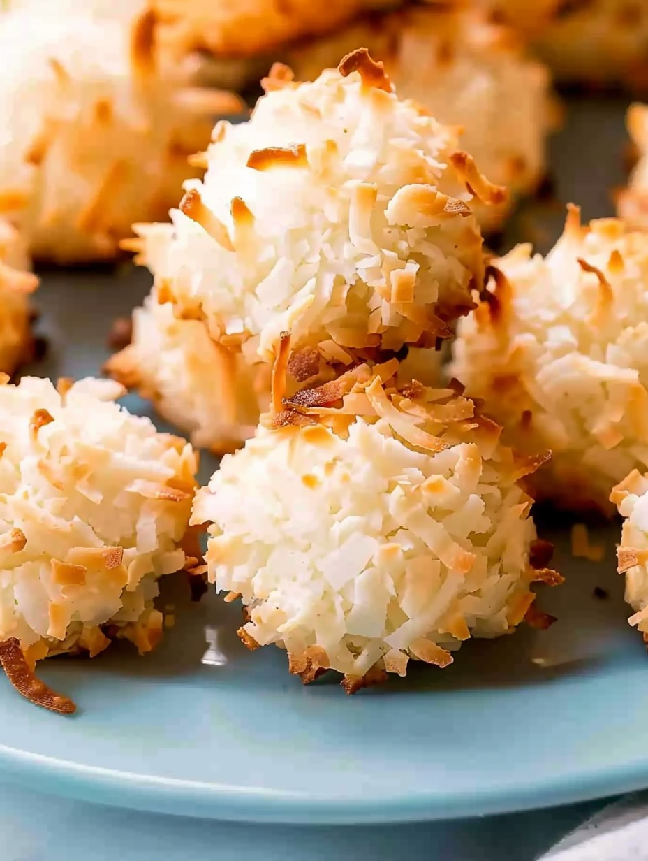 Macaroons arranged on a serving board with coffee