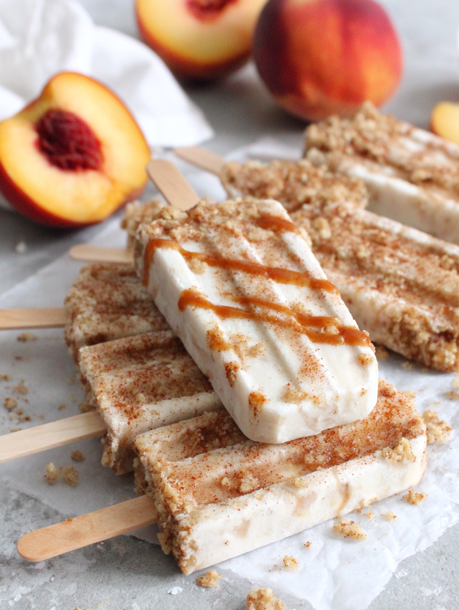 Peach streusel popsicles on a tray