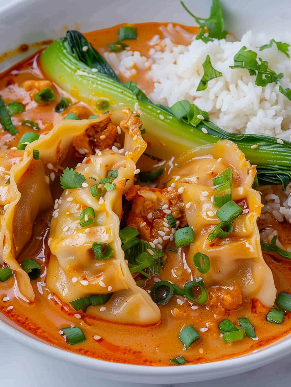 Close up of dumplings topped with sesame seeds and green onions