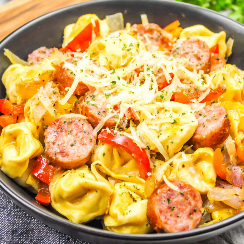 User provided content image 2 highlighting close-up of cheesy tortellini and browned kielbasa