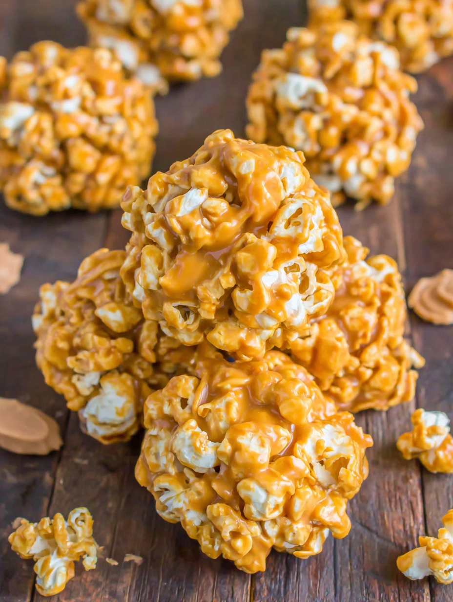 Popcorn balls being shaped on wax paper