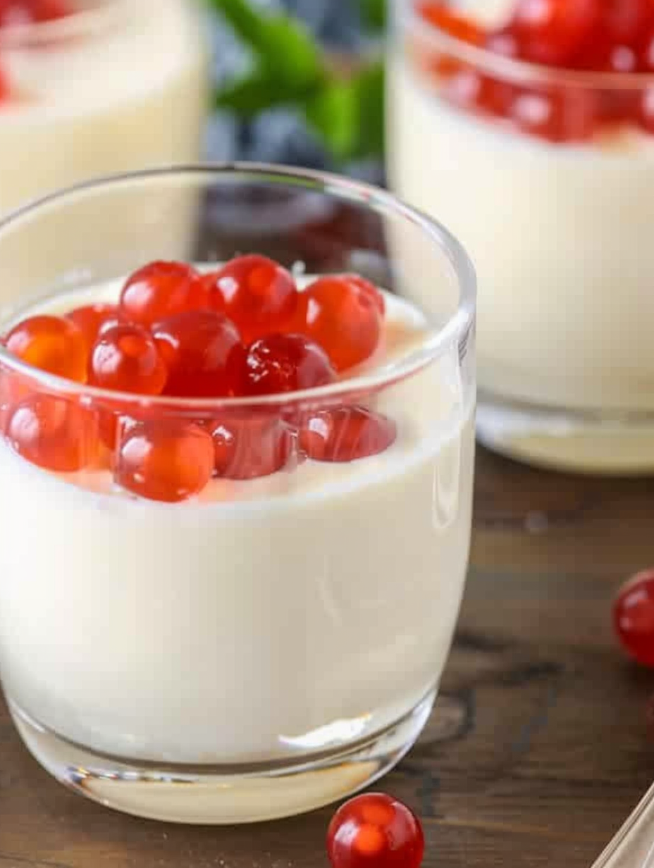 Close-up of panna cotta texture with spoon