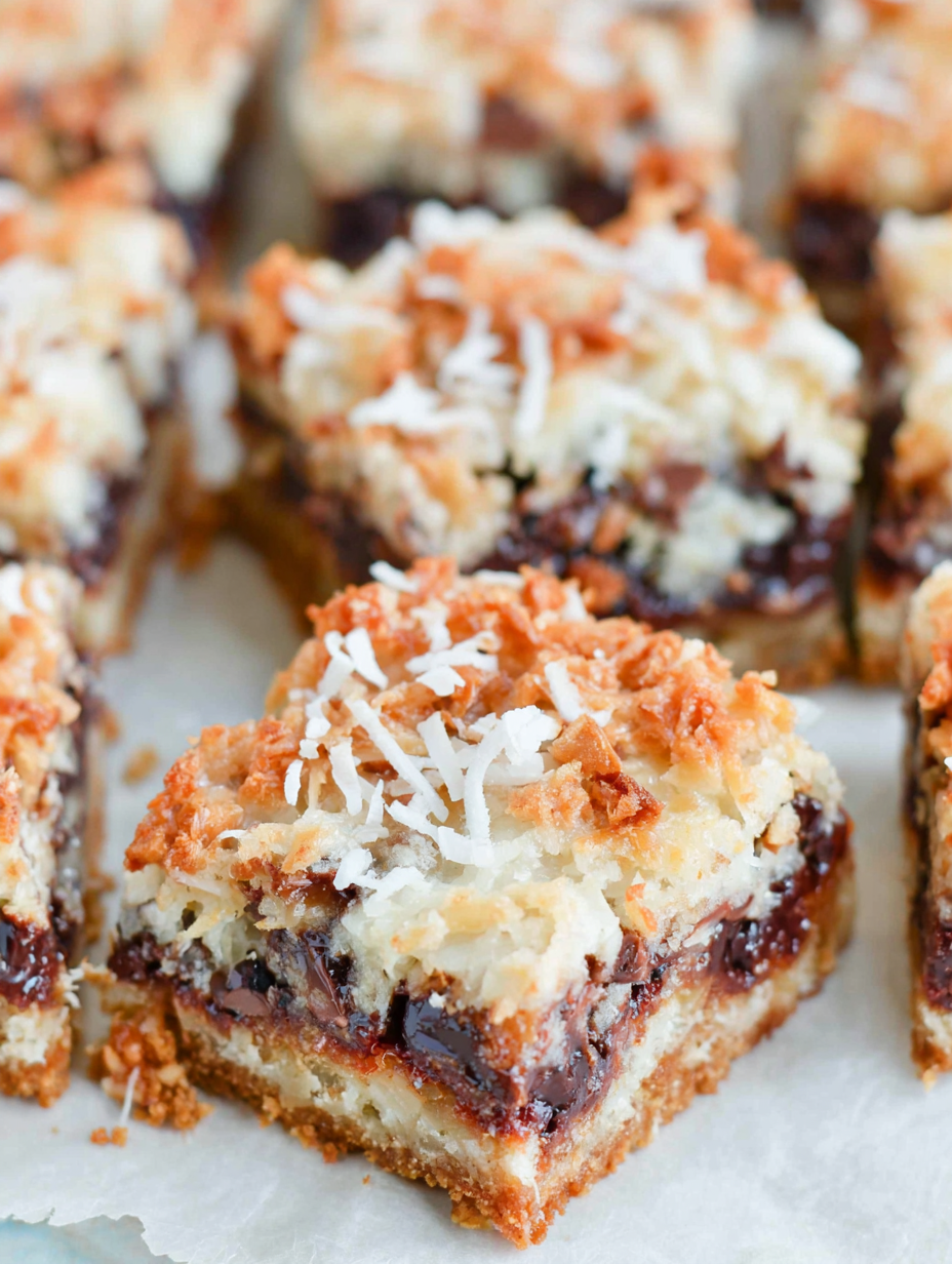 7-layer bars in pan with golden coconut topping