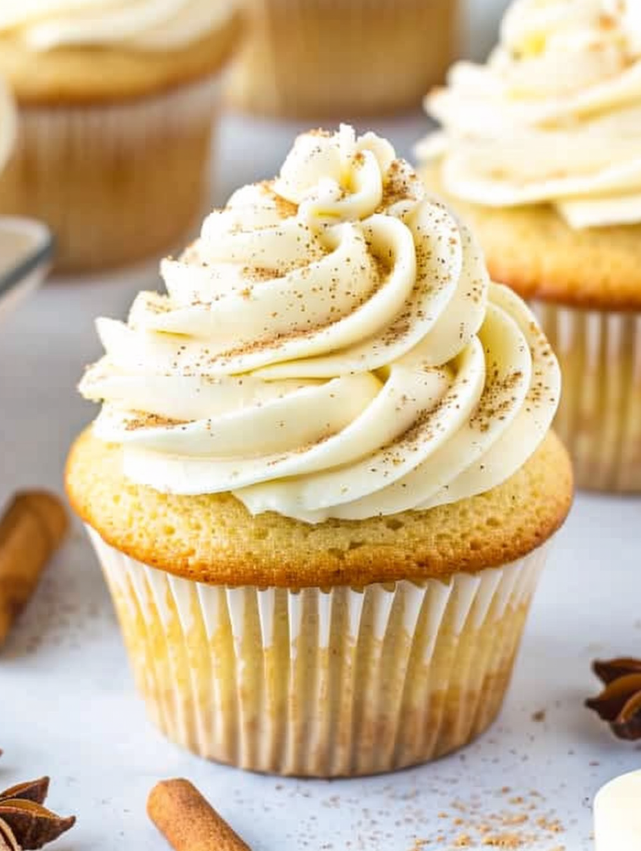 Eggnog cupcakes cooling on a rack