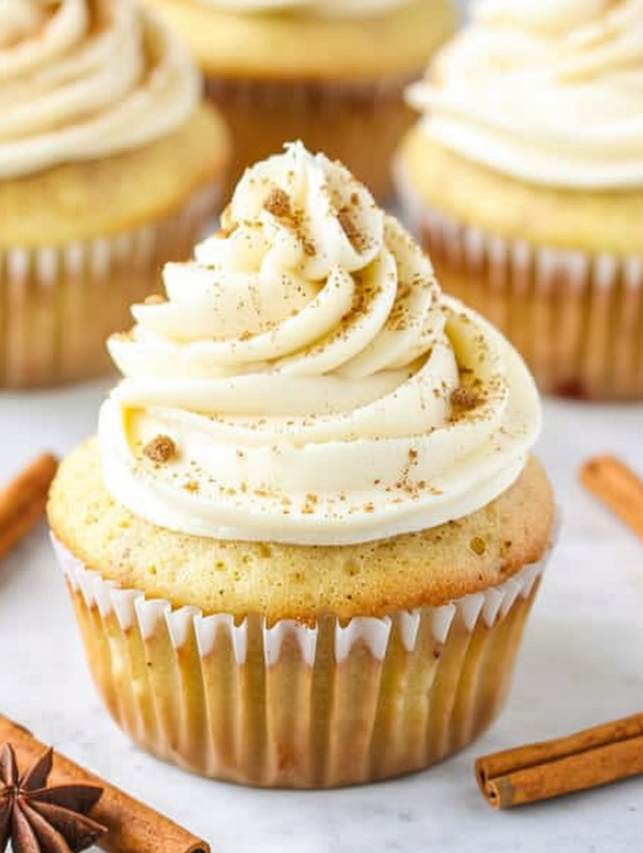 Frosted eggnog cupcakes garnished with nutmeg