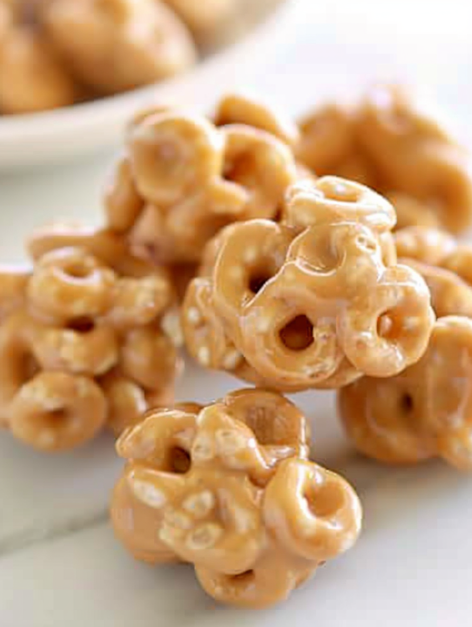 Warm bowl of peanut butter and honey mixture being stirred