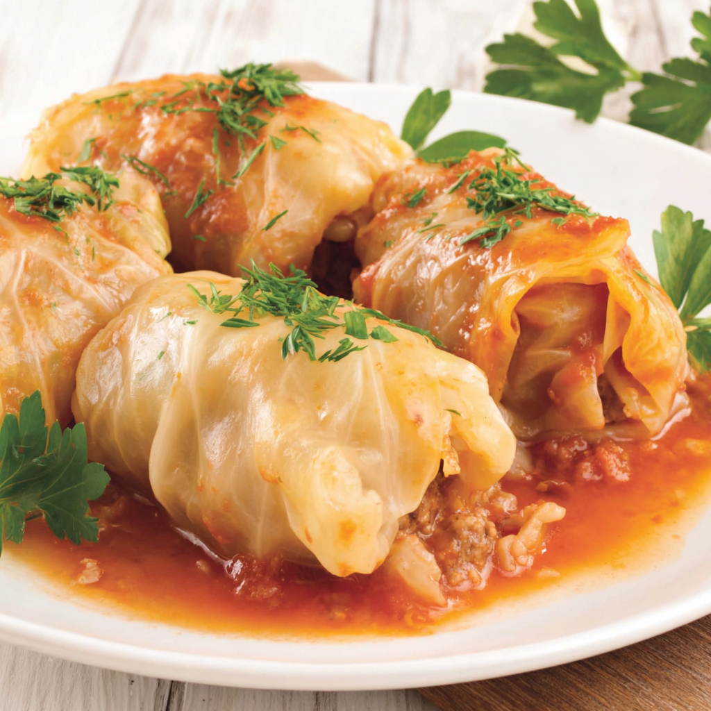 Golubtsy stuffed cabbage rolls simmered in tomato sauce