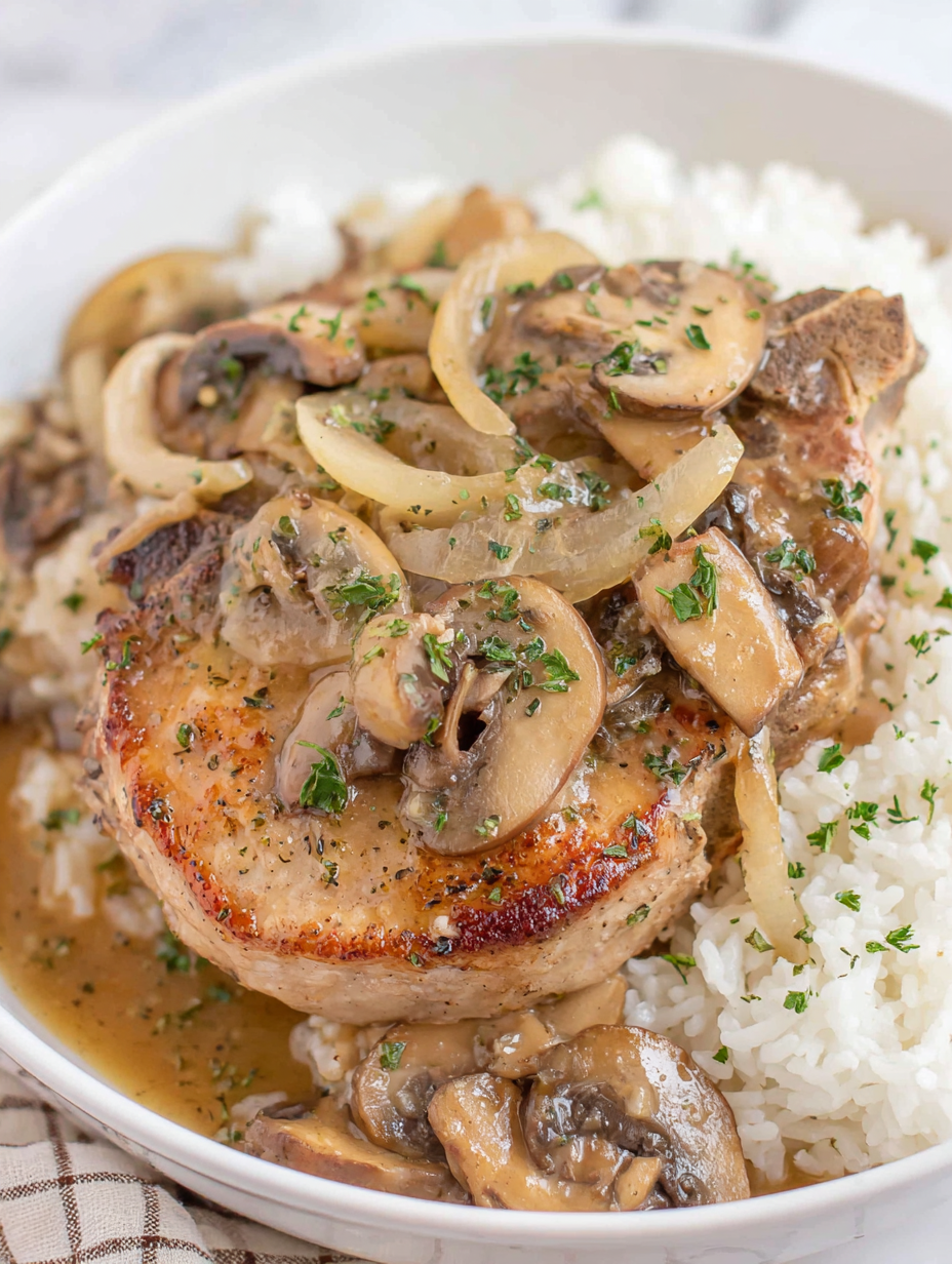Slow cooker pork chops with mushrooms on rice