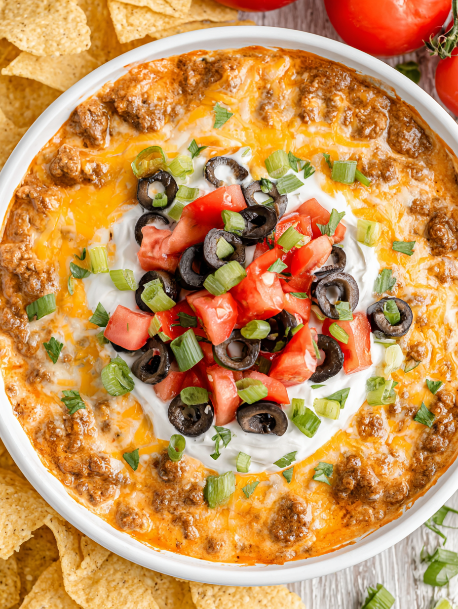 Slow cooker crockpot taco dip bubbling with cheese