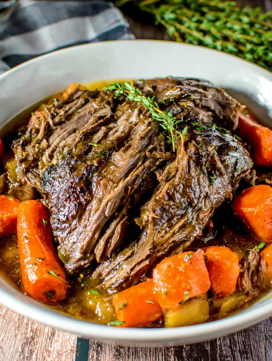 Slow cooker pot roast resting on a cutting board