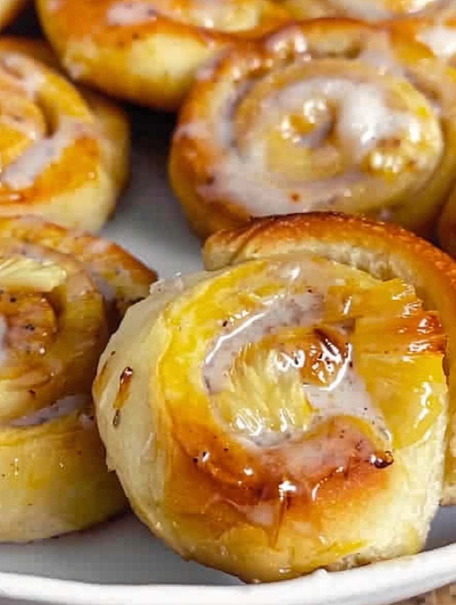 Glazed orange pineapple rolls close-up