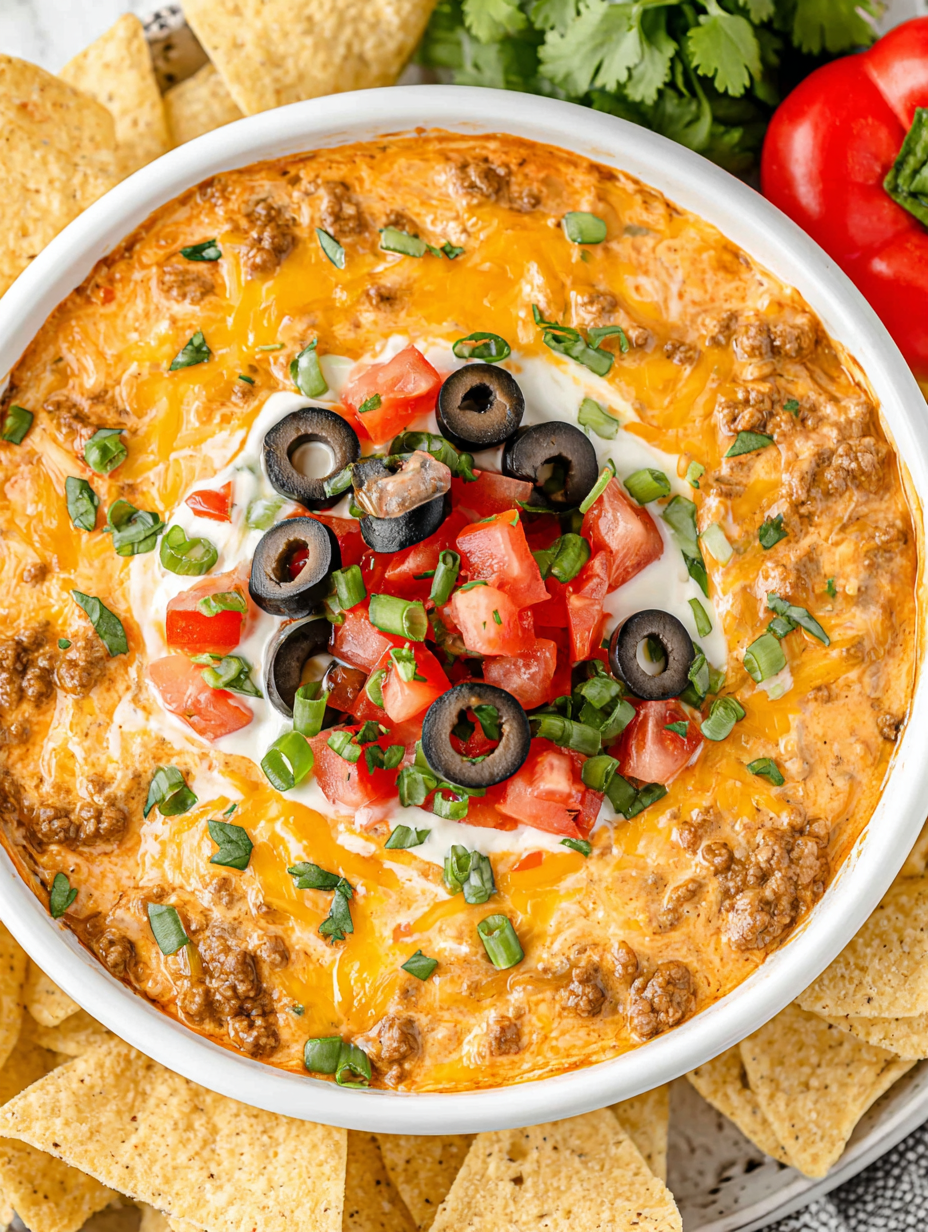 Crockpot Taco Dip bubbling in a slow cooker
