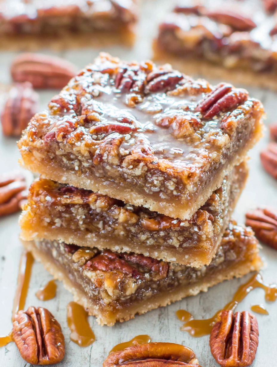 Close-up of pecan pie bars with caramel drizzle