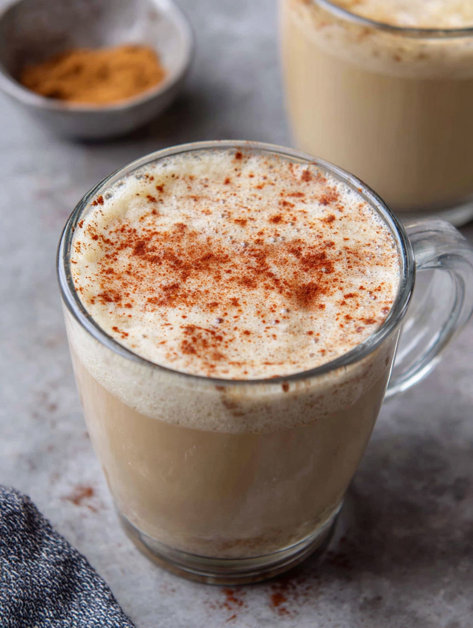 Iced chai tea latte served with ice cubes and cinnamon