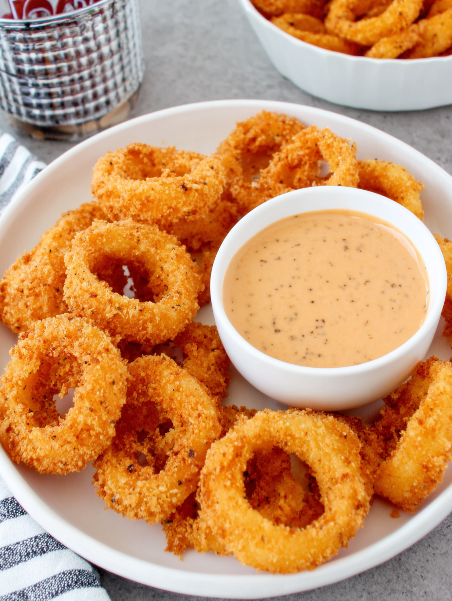 zesty sauce in a small bowl with onion rings