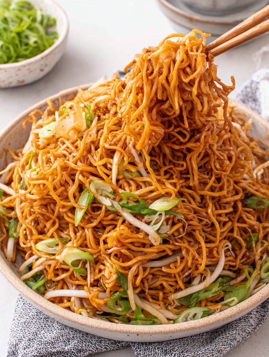 Close-up of tossed chow mein with scallions and bean sprouts