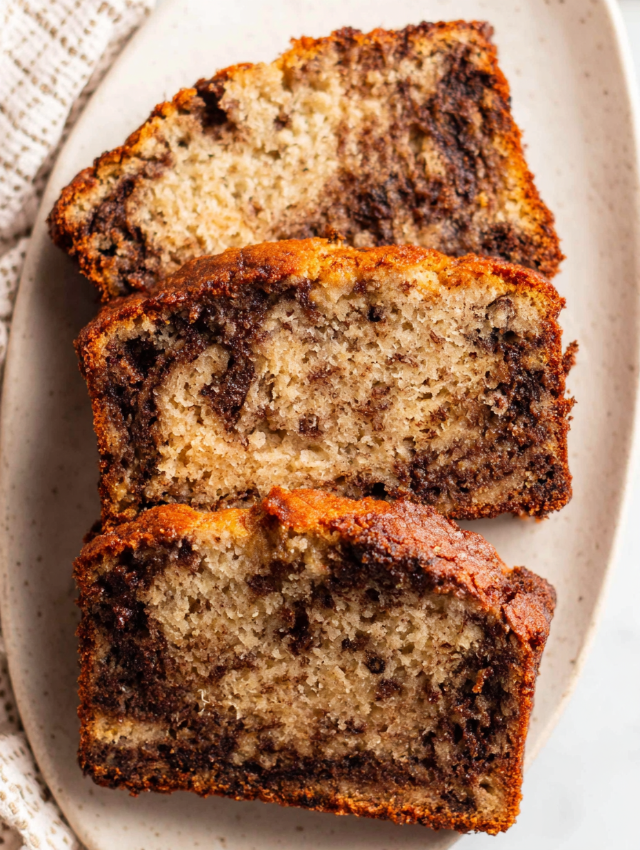 Banana bread loaf cooling on rack