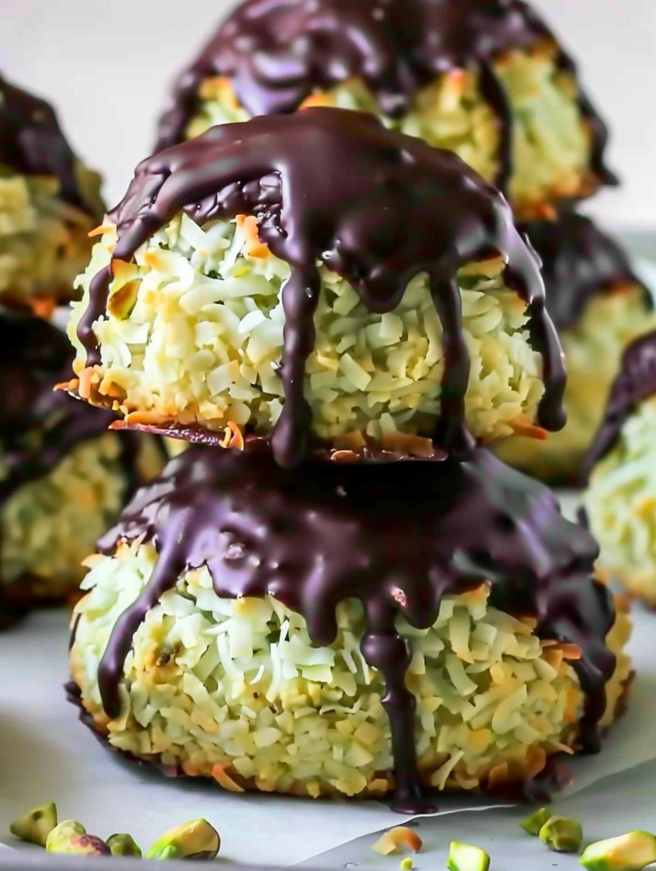 Pistachio Coconut Macaroons on parchment with chocolate tops