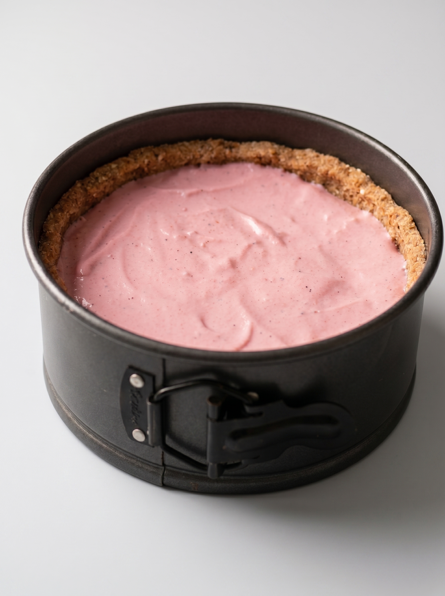 Vegan no-bake cheesecake sliced in springform pan