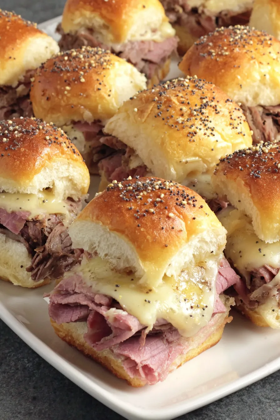 Tray of assembled roast beef sliders before baking