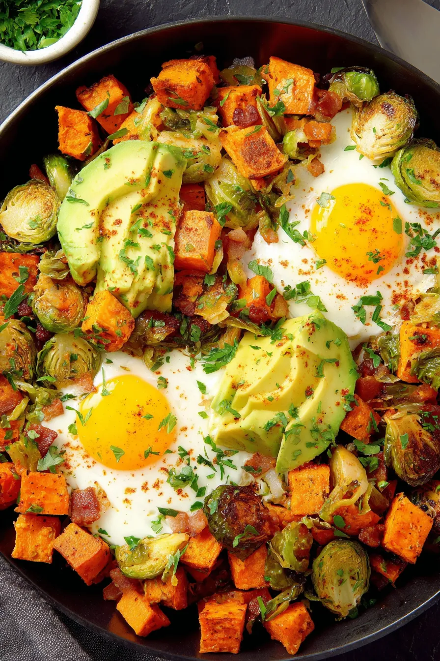 Close up of crispy sweet potato cubes and browned Brussels sprouts