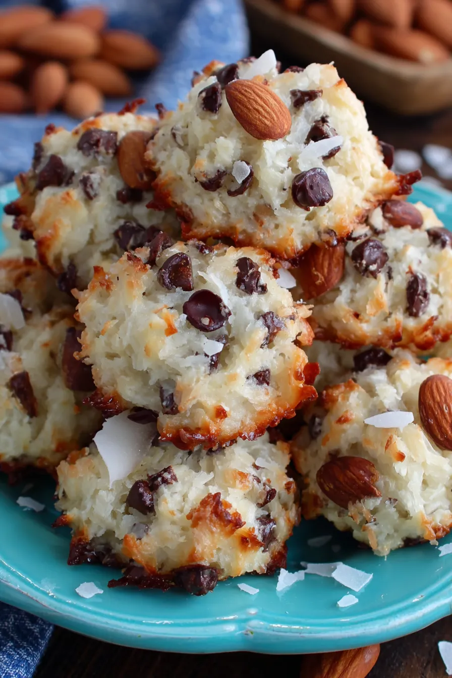 Freshly baked Almond Joy cookies on a parchment-lined baking sheet