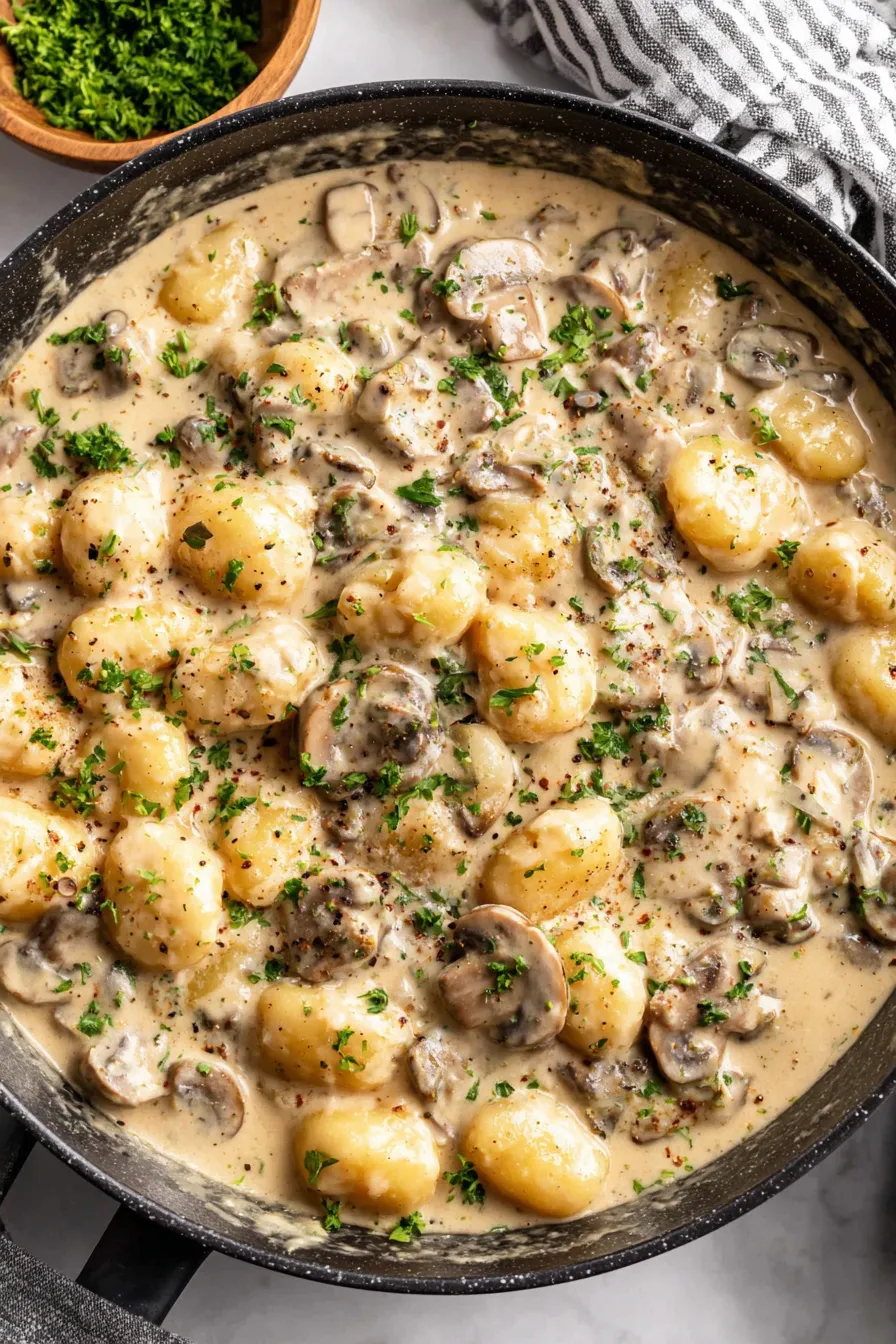 Creamy Boursin gnocchi in skillet with mushrooms
