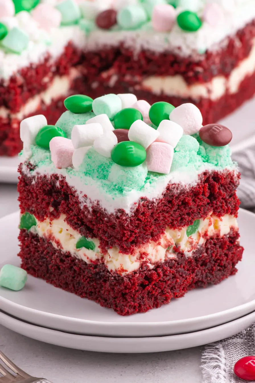 Christmas Red Velvet Poke Cake with green whipped topping