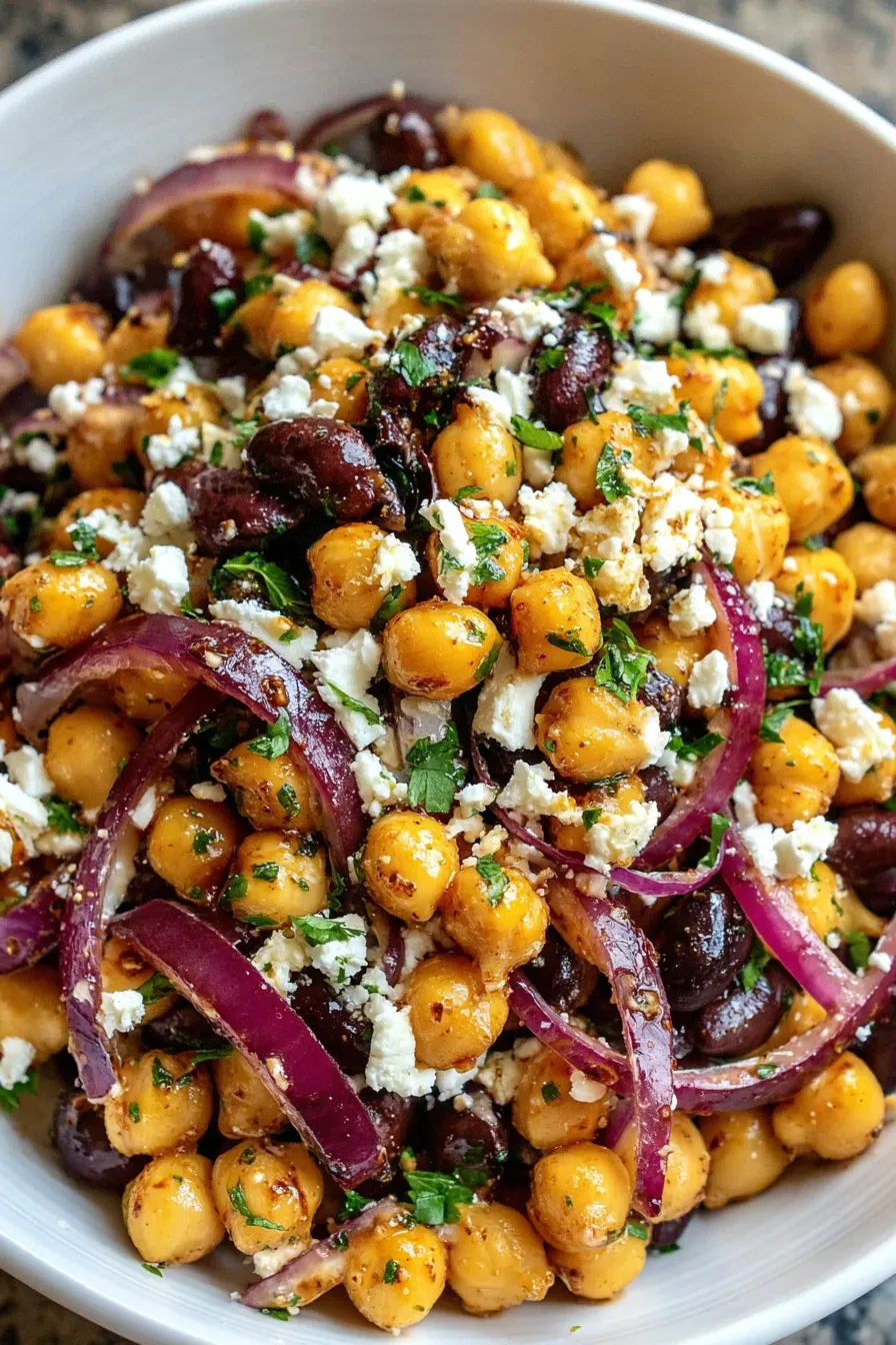 Close-up of salad showing beans, feta, and parsley