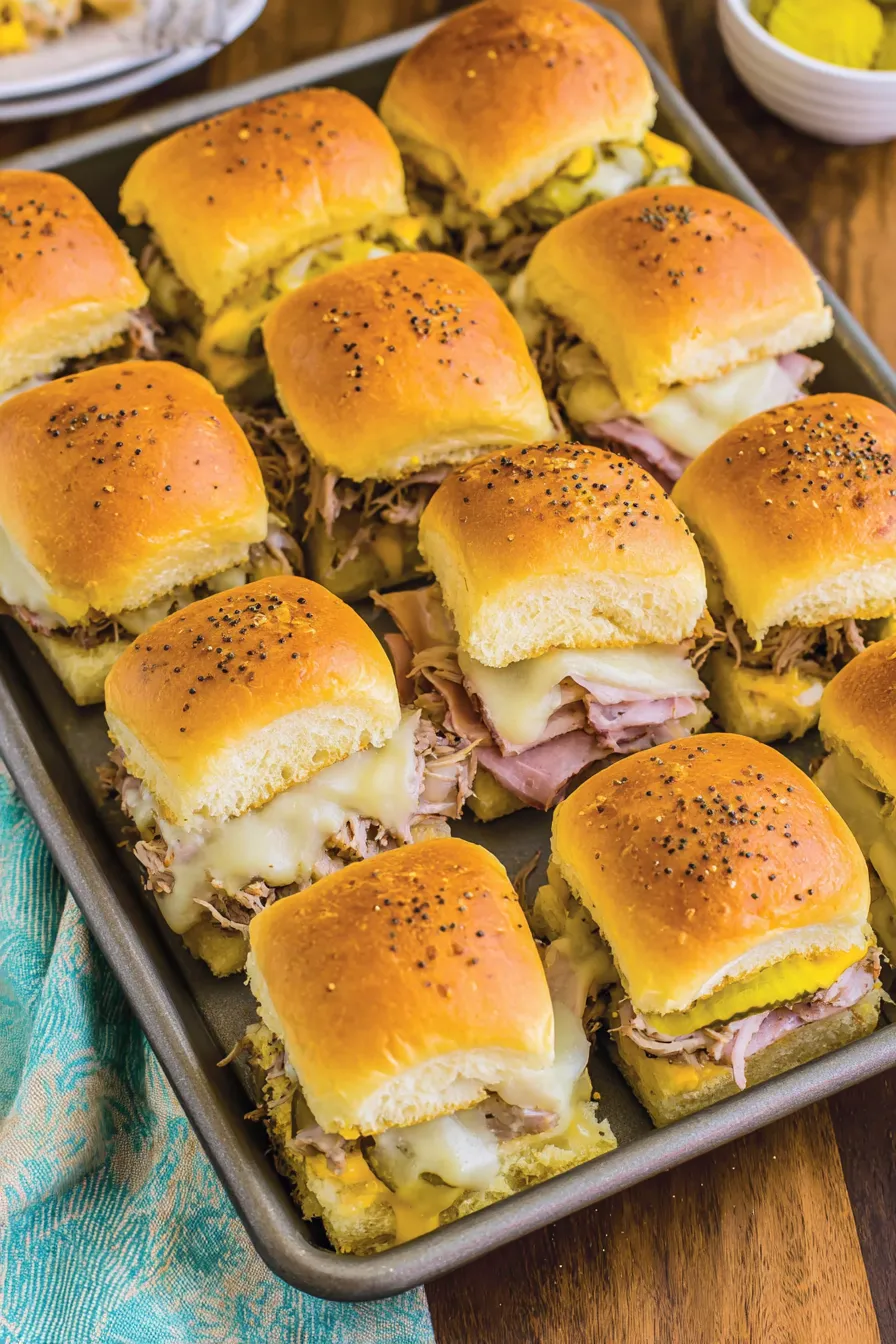 Two rows of Cuban sliders in a casserole dish