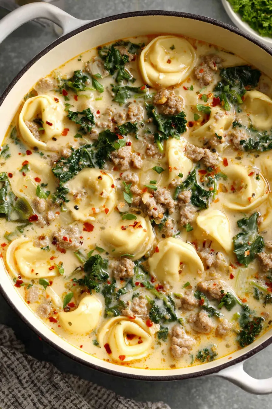Sausage tortellini simmering in a pot
