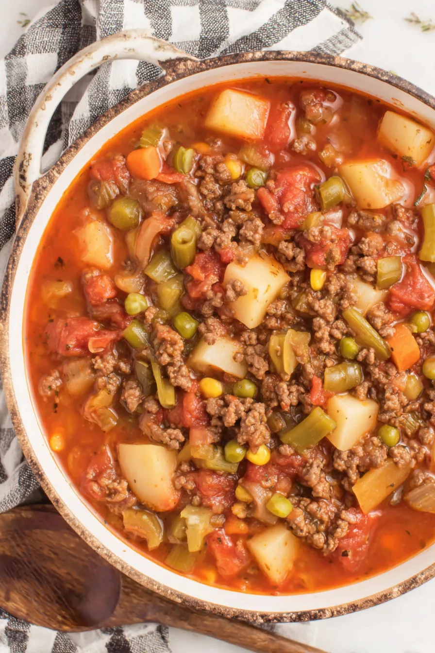 Preparation of ingredients for hamburger soup on a cutting board