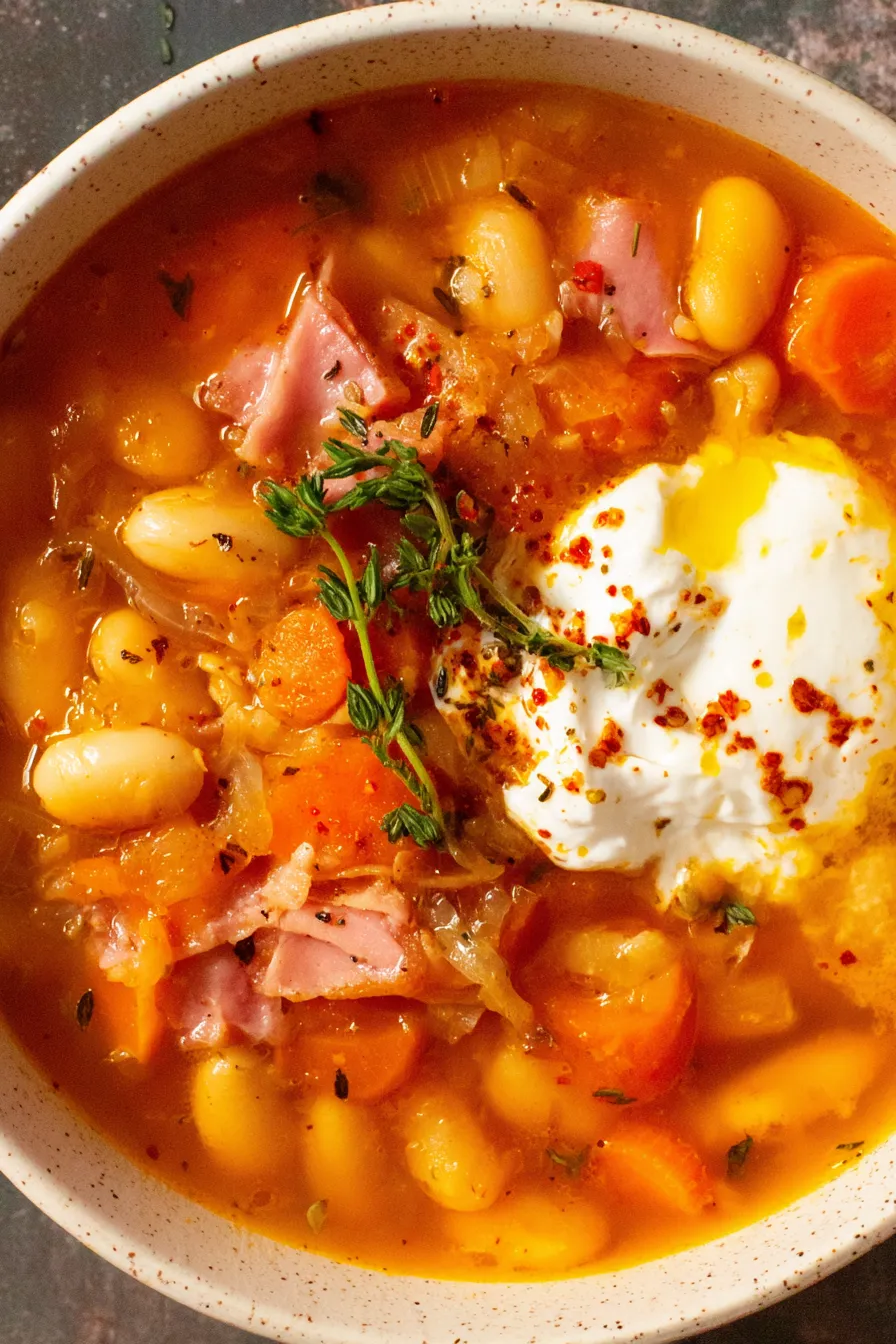 Slow Cooker Ham and White Bean Soup simmering in pot