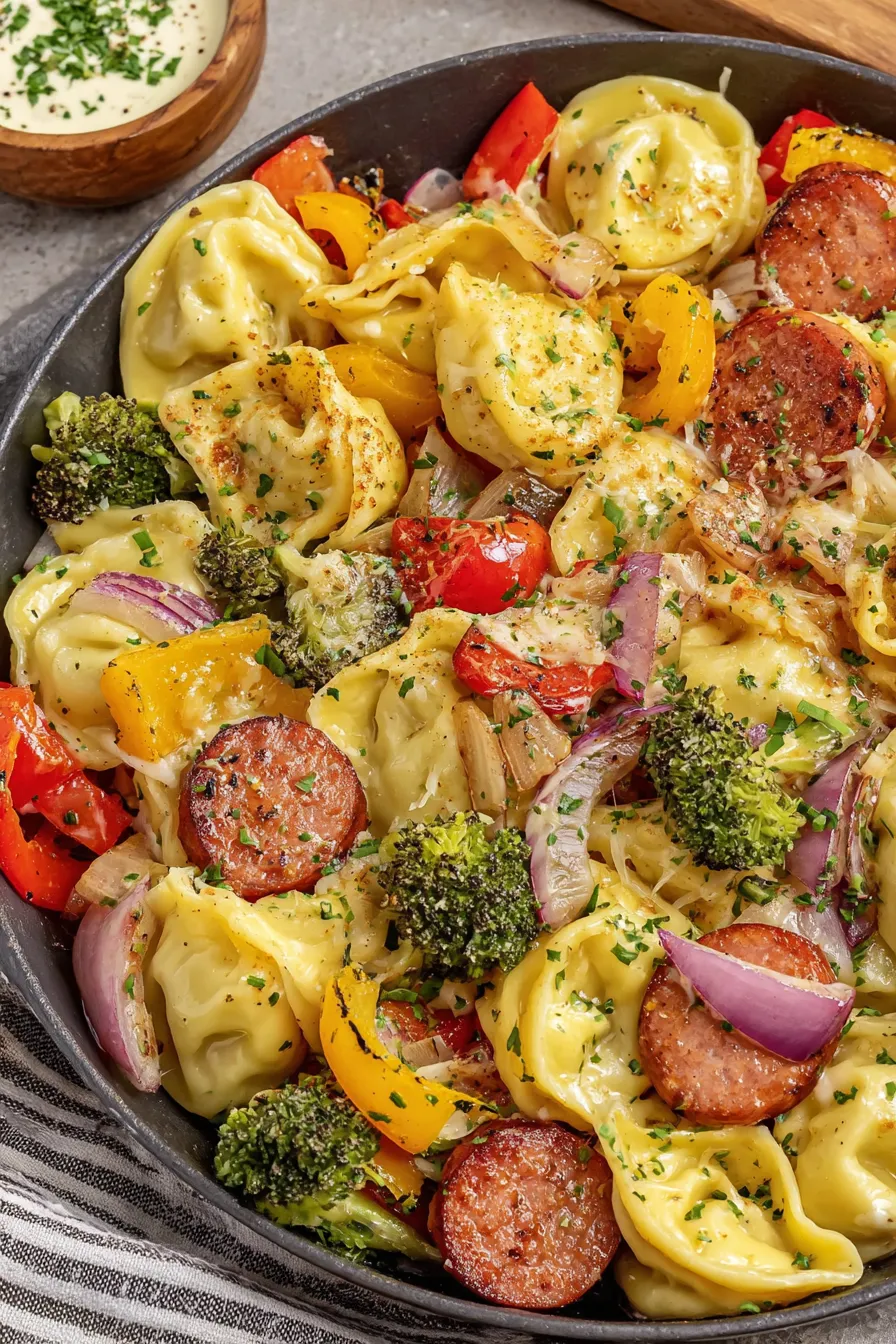 Close up of golden pierogi and kielbasa pieces