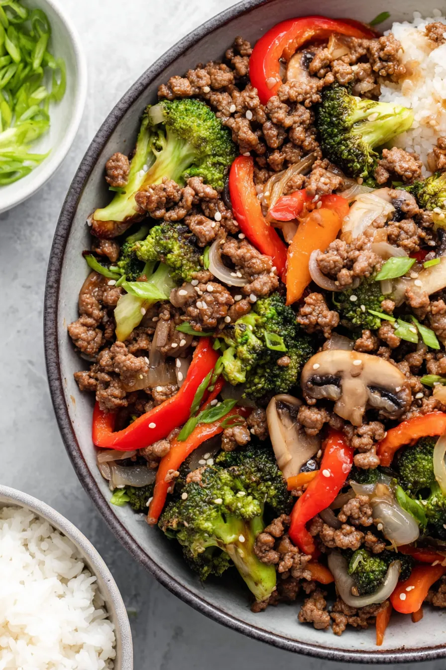 Ground beef stir fry in skillet, close-up