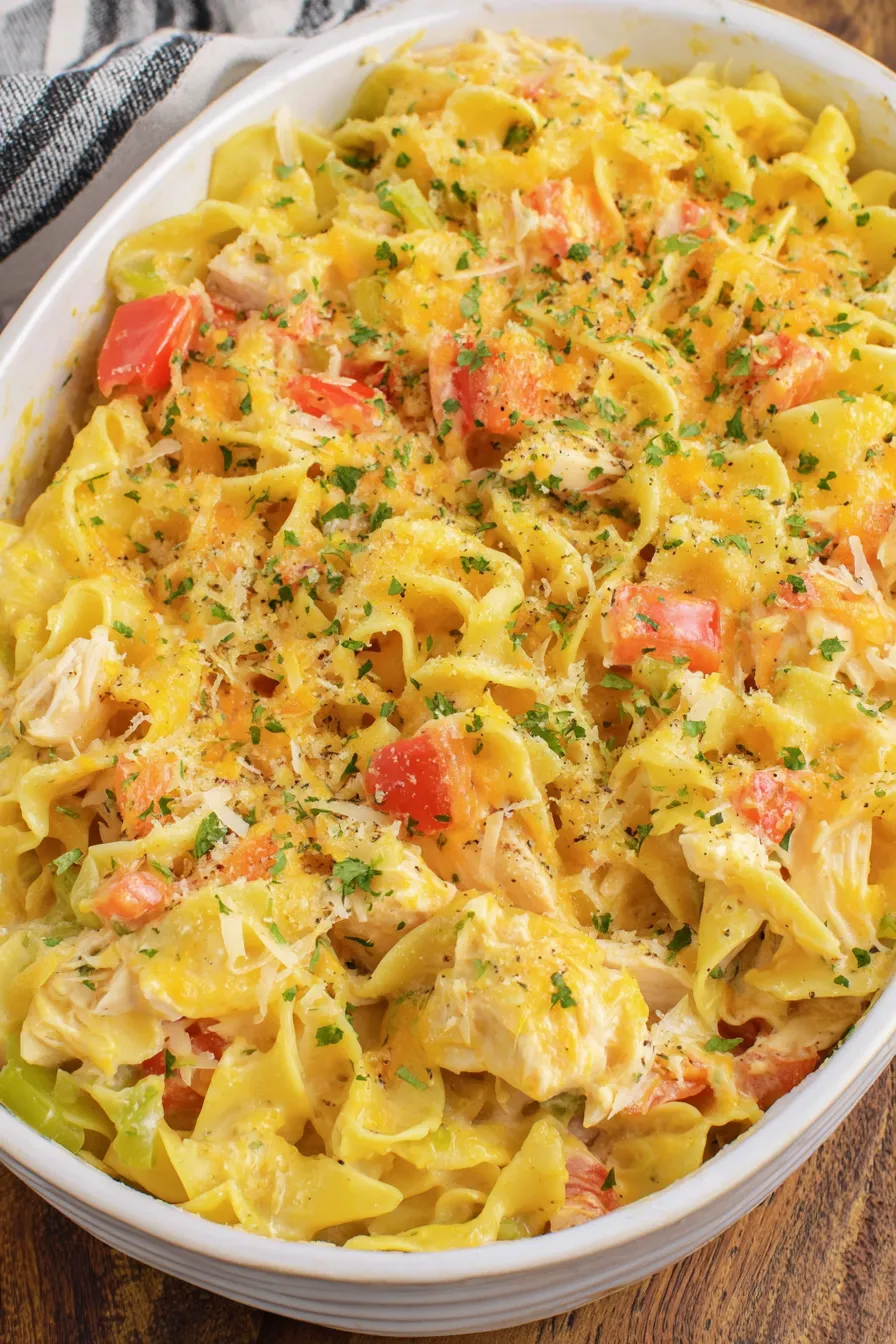 Close-up of shredded chicken and noodles in creamy sauce