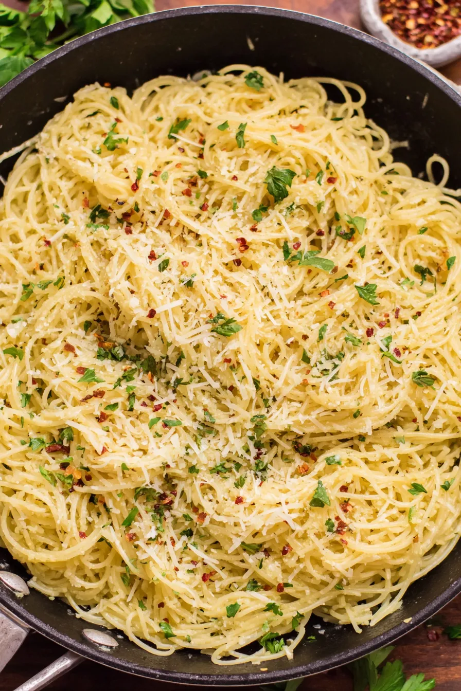 Finished parmesan noodles plated with parsley