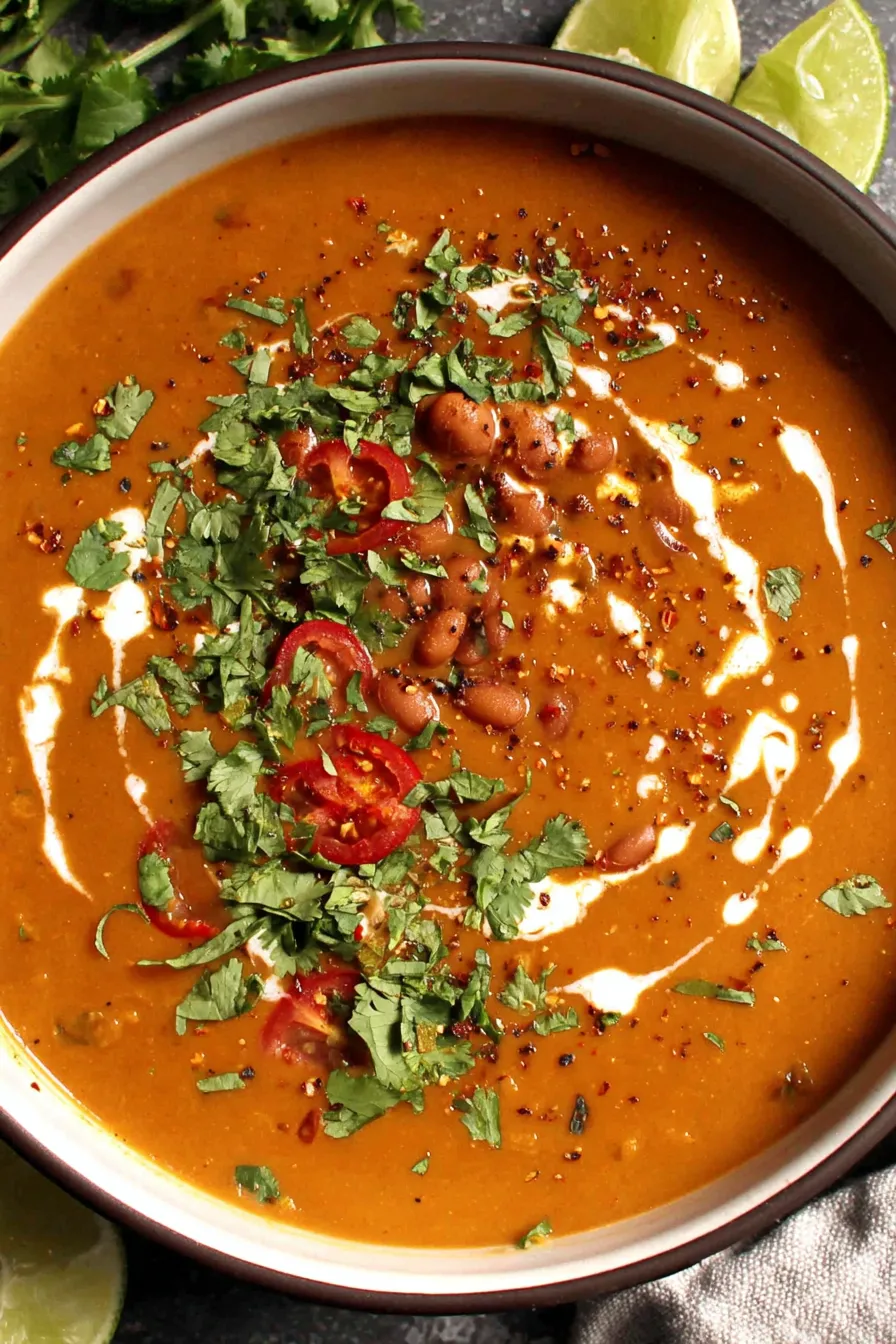 Finished soup garnished with crema and cilantro