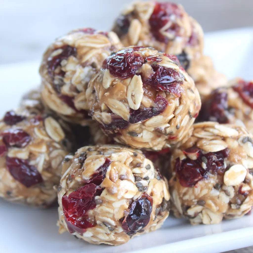 Close-up of a single energy bite with cranberries and almonds