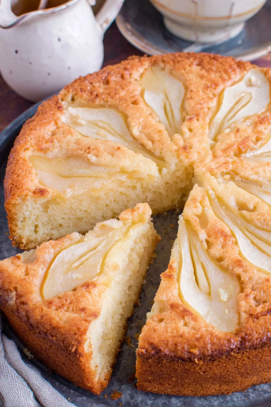 Sliced pear arranged on top of cake before baking